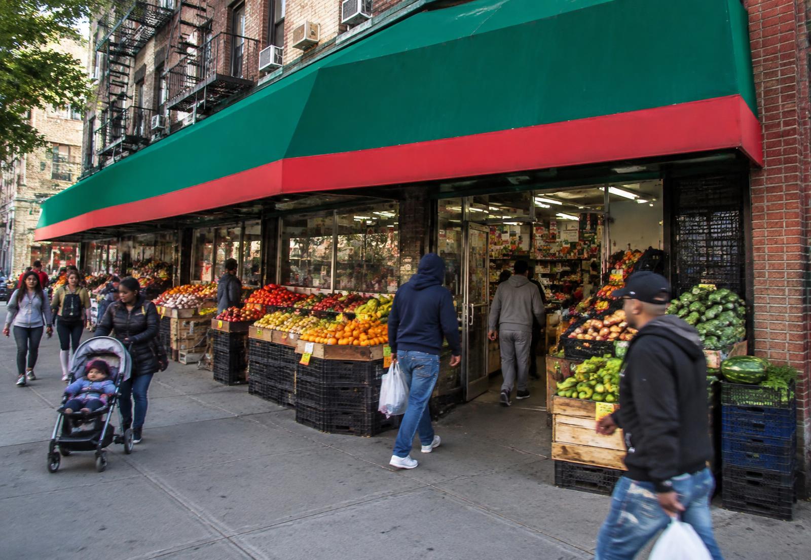 Jumbo Supermarket storefront with fresh produce displayed on the sidewalk